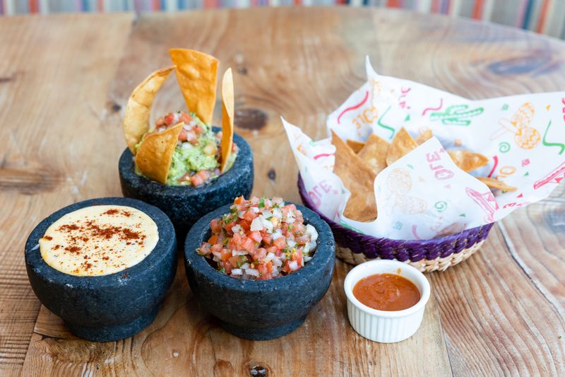 Fresh-fried tortilla chips served with house salsa at Chuys