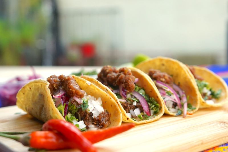 Chuys carne asada street tacos with fresh toppings