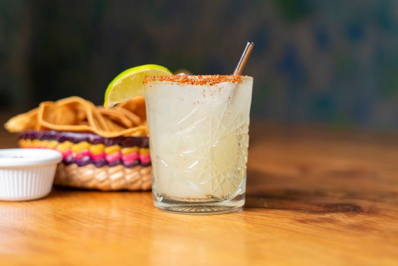 Chuys frozen mango margarita with tajin rim